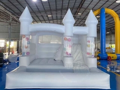 white bounce house with slide